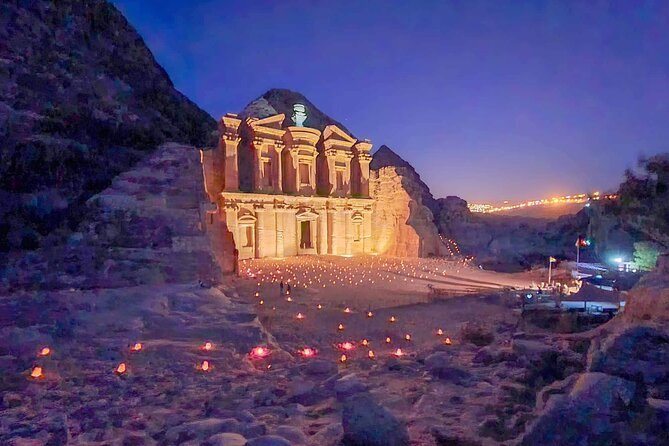 Candles laid out across the Treasury forecourt at Petra after dark